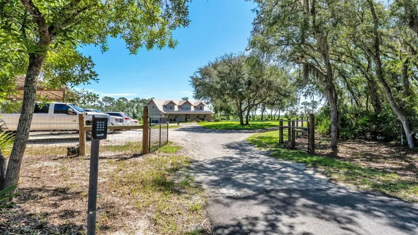 Entry Gate into Fenced Area with Home