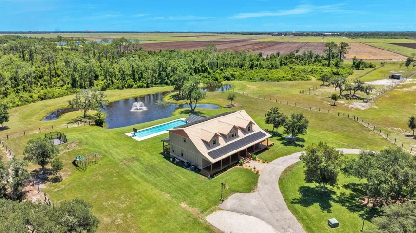 Overhead View of House, Pool, Pond, Property