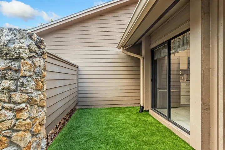 Front courtyard with premium turf you don't need to water!