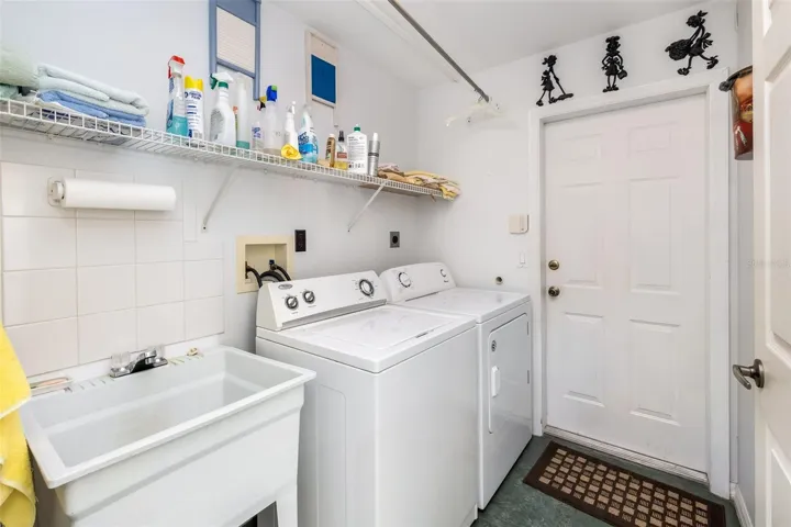 Laundry room that leads out to garage