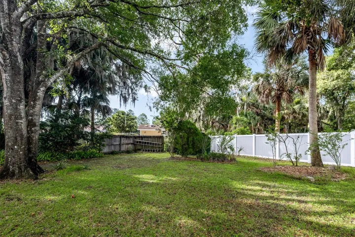 Large partially fenced in yard
