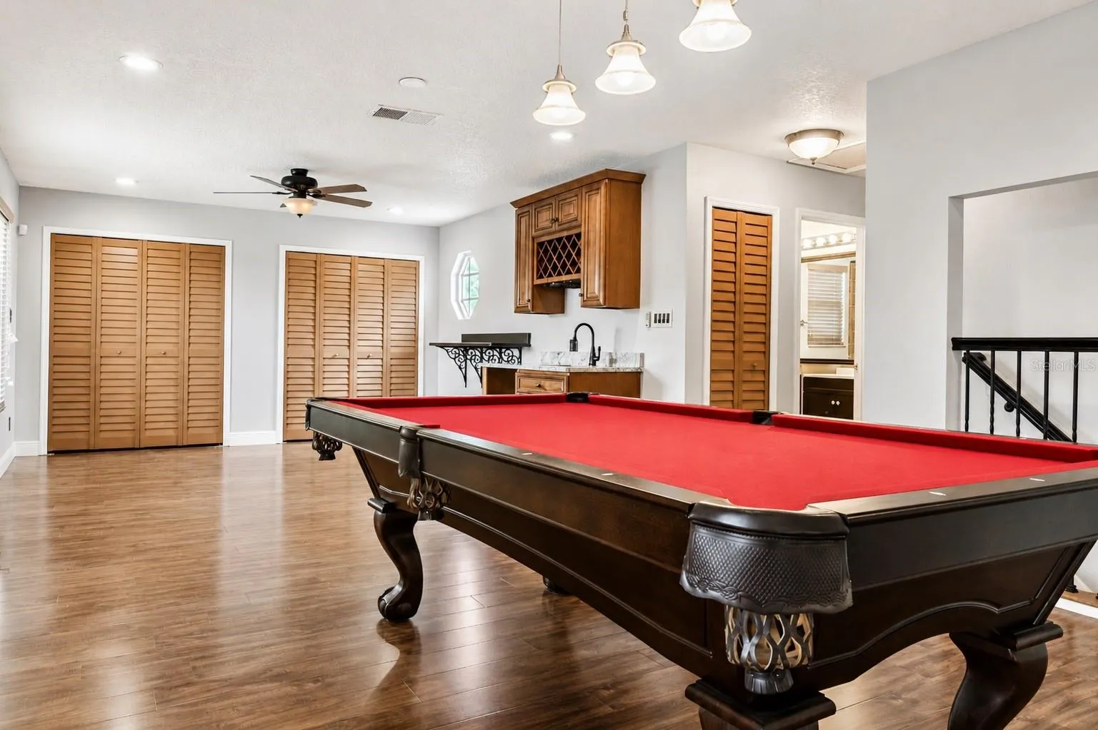 Finely Crafted Wet Bar And Custom Closet Doors And Linen Closet. State of The Art Pool Table
