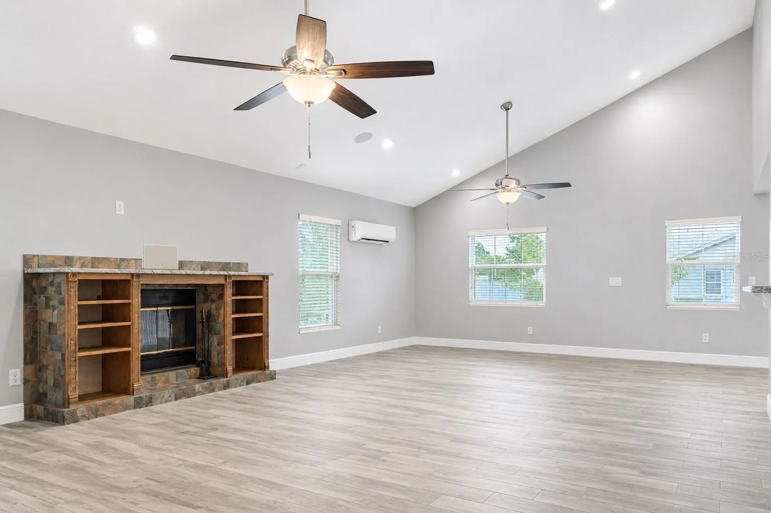 Hurricane Custom Windows Throughout & Climate Controlled Daikin Mini Spit AC Unit. Custom Surround Sound built directly into the  Artisan Custom-Built Fireplace wall.