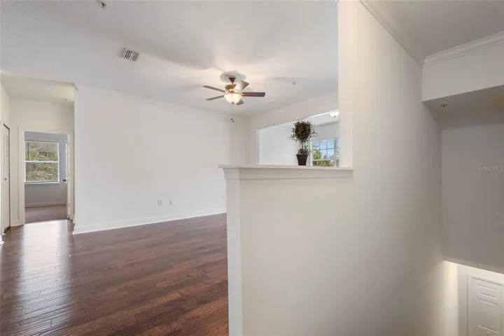 Top of landing after ascending the staircase. Beautiful Engineered hardwood flooring.