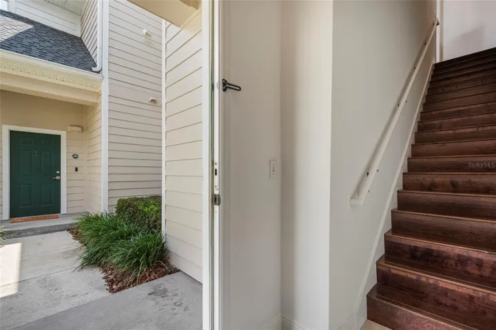 Entry way, engineered wood flooring on staircase.