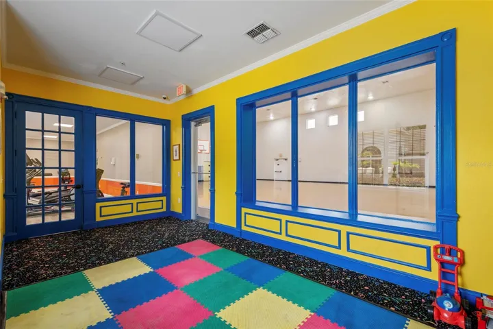 Tot room for playtime while adults play near by in fitness room