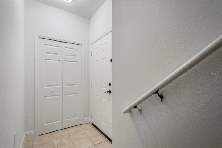 Entry area with closet on lower level.