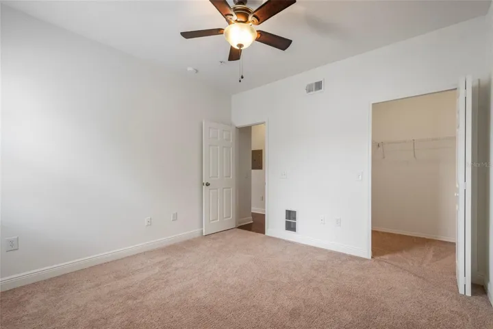 3rd Bedroom, new carpet, ceiling fan and walk in closet as well freshly painted.