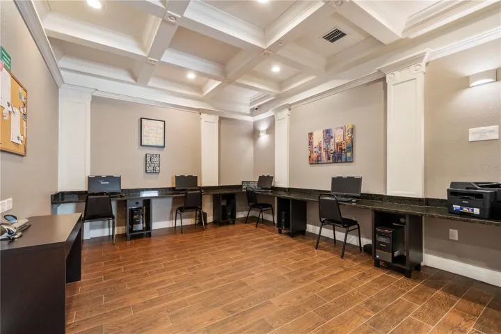 Computer room and desk area with printer for residents use.