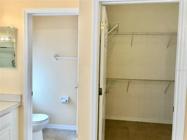 Walk-in closet and water closet in master bath.