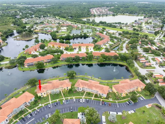 Aerial view of the Resort and resort community.  Caliente Resort is in far background.  Manolia Pt community is to the far back right on the lake.  Condo C-206 is where the red arrow is pointin.