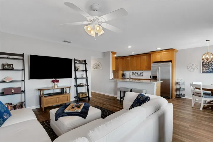 Living Room Open to Kitchen With Breakfast Bar. Dining Area to the Right
