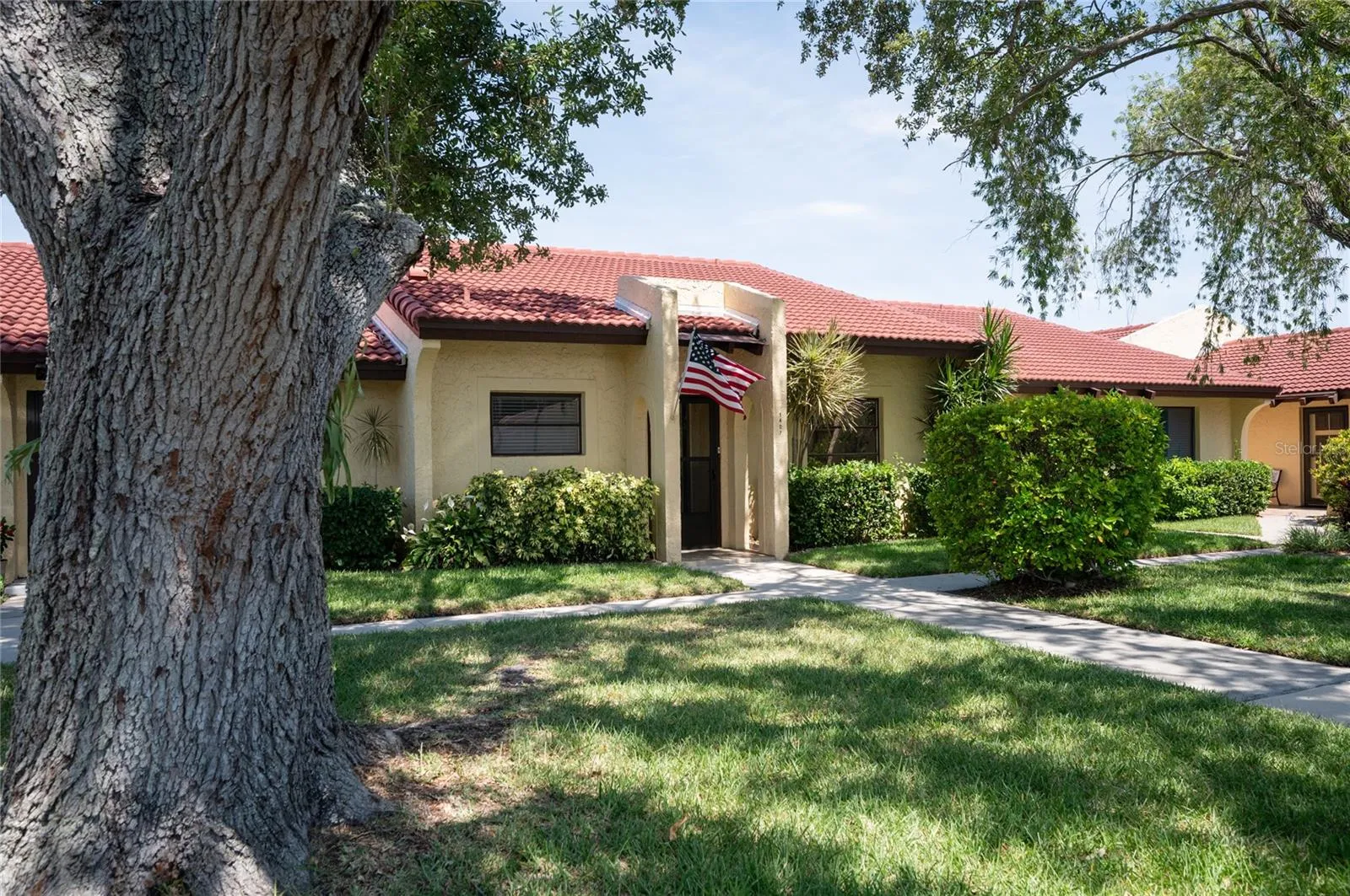 This unit is located in the center and has a sidewalk leading to the unit