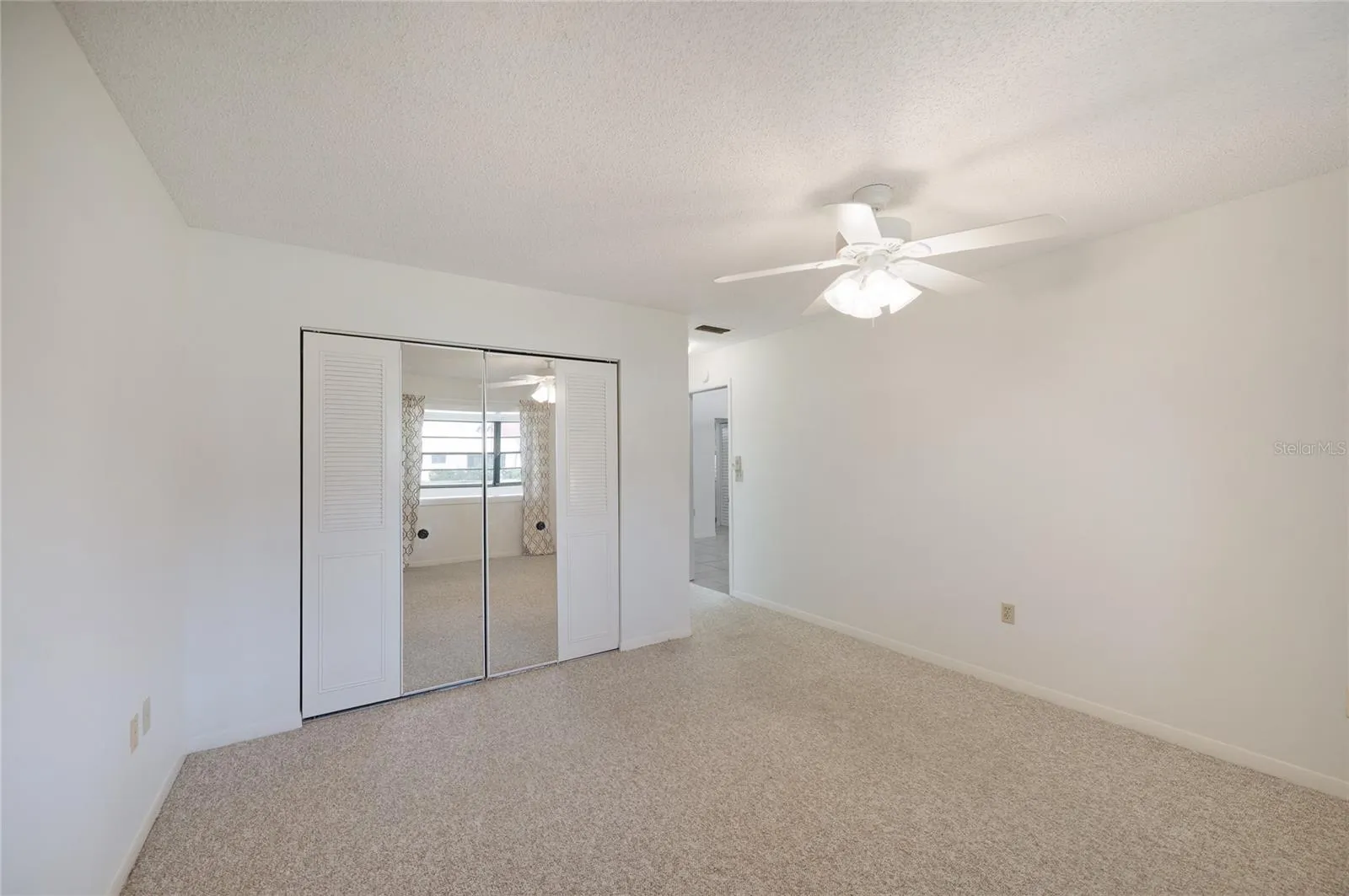 Primary bedroom with carpet