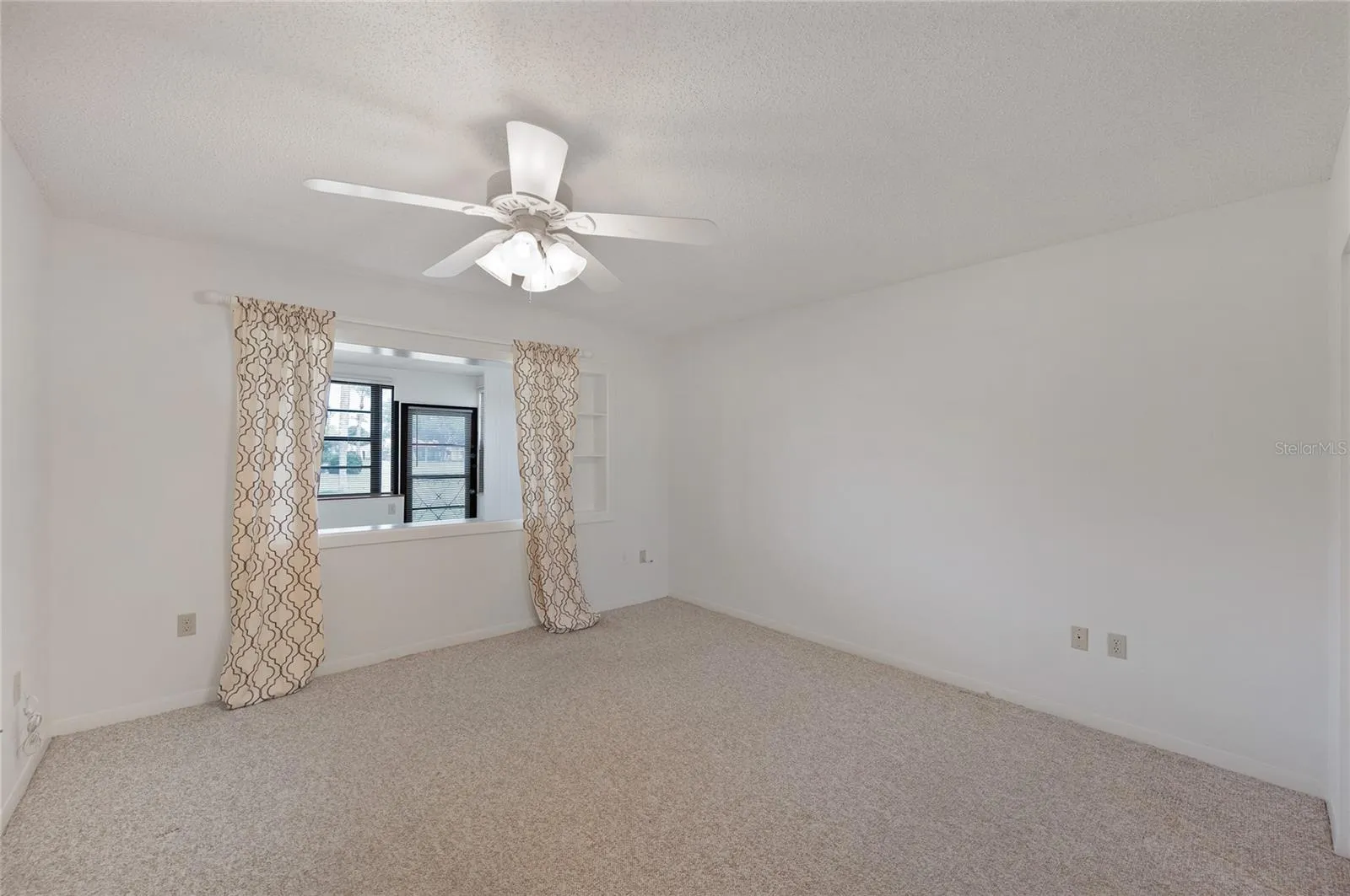 Spacious Primary bedroom with views of the greenspace