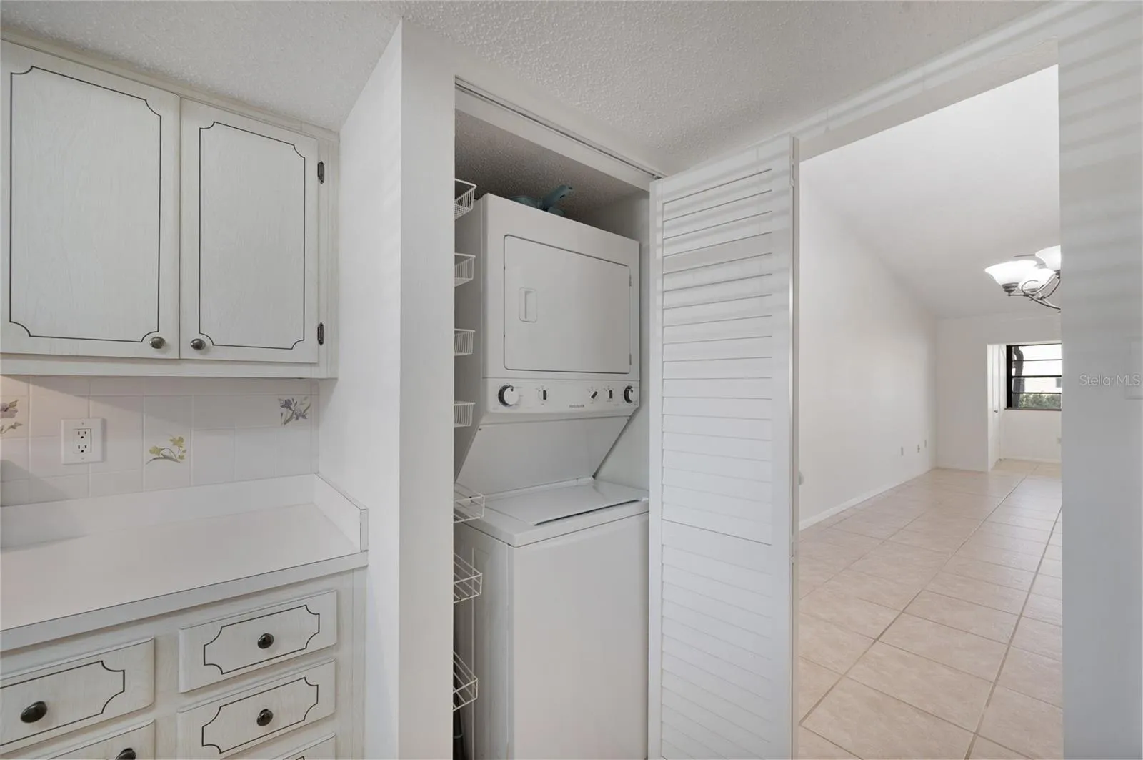 Stack washer and dryer in the kitchen area