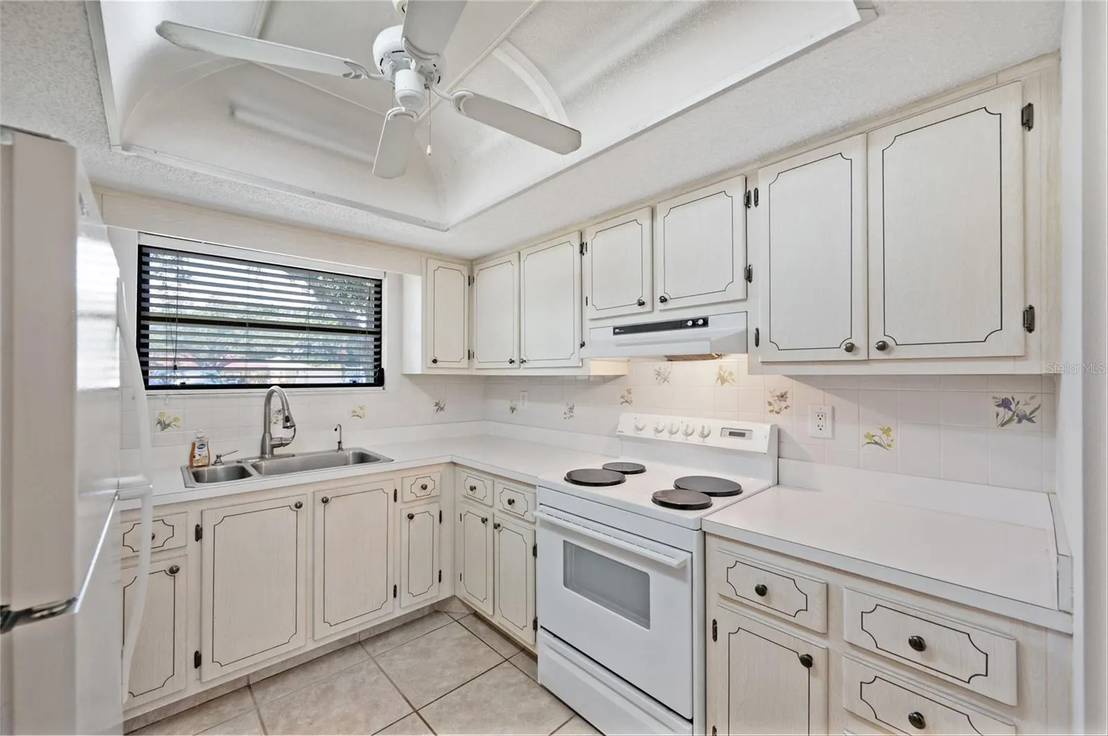 Kitchen with window to enjoy the mature trees and landscape outside