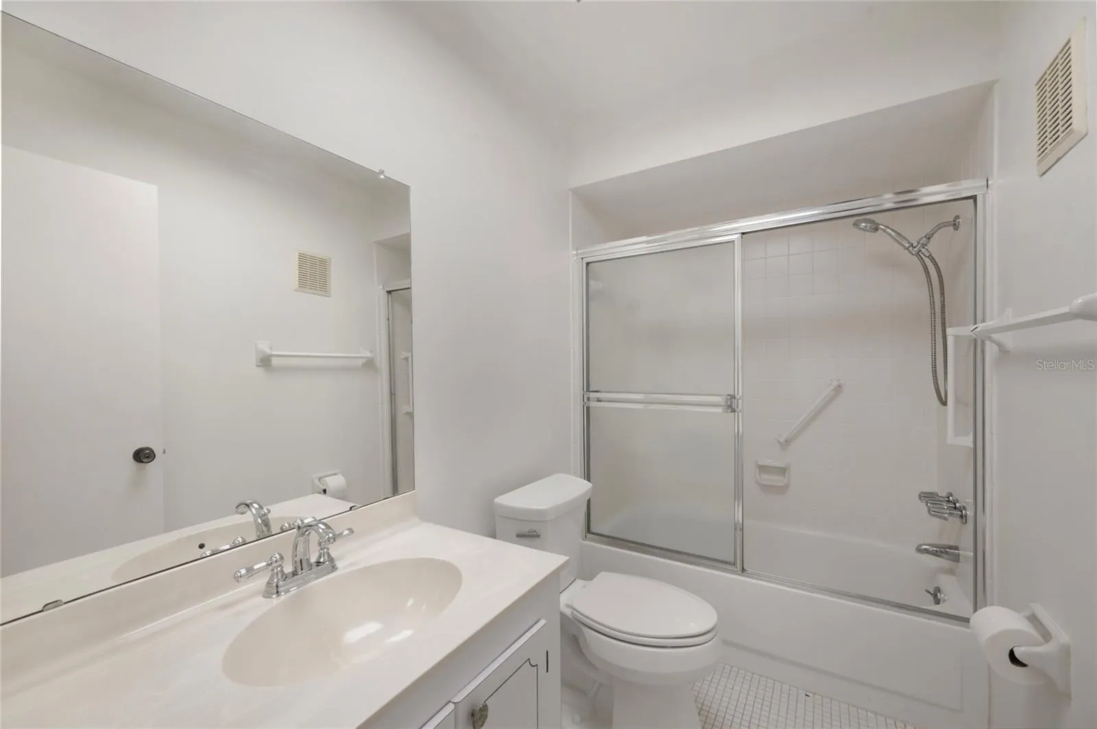 Guest bathroom with tub/shower ensuite to guest bedroom and accessible to the living area for guest use