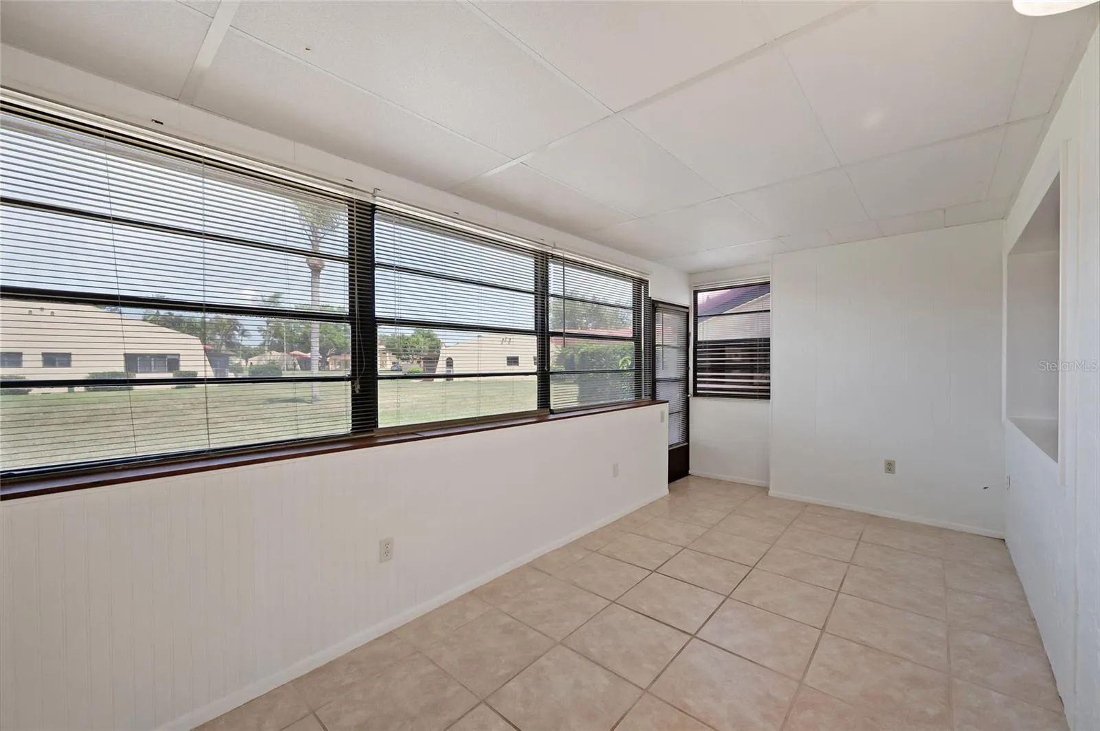 A door from the Florida room leads you to the back where you can relax and enjoy the outdoors