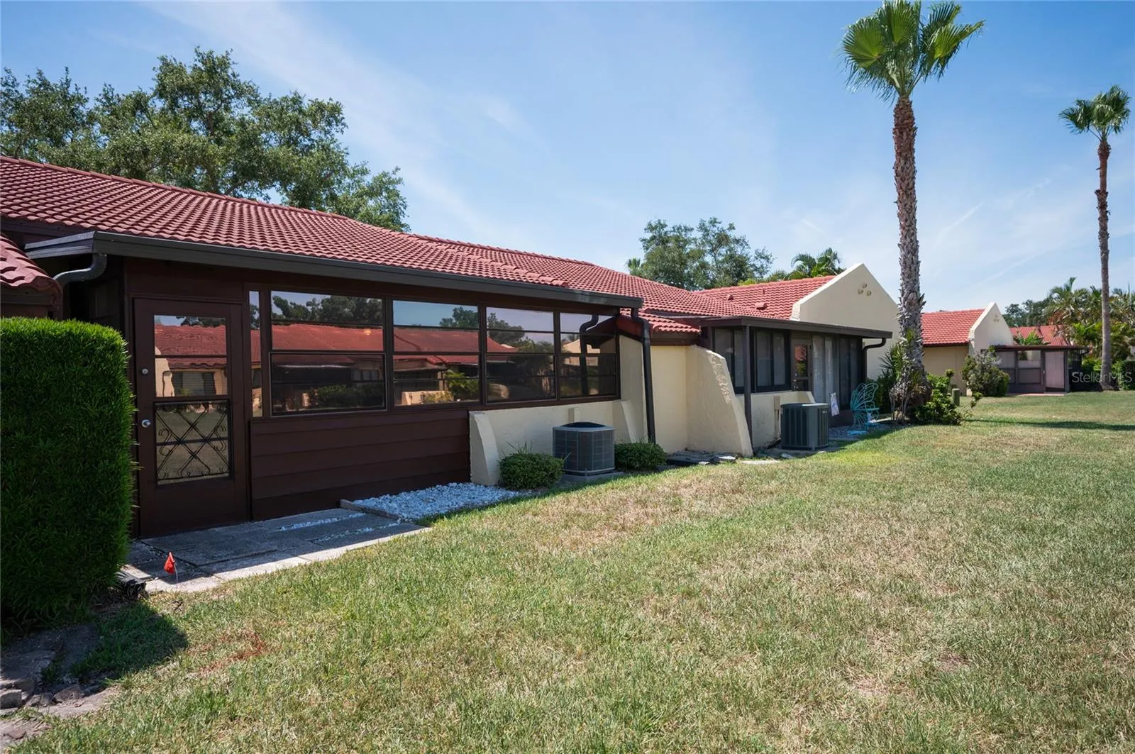 The back of the villa showing the greenspace for enjoying the outdoors