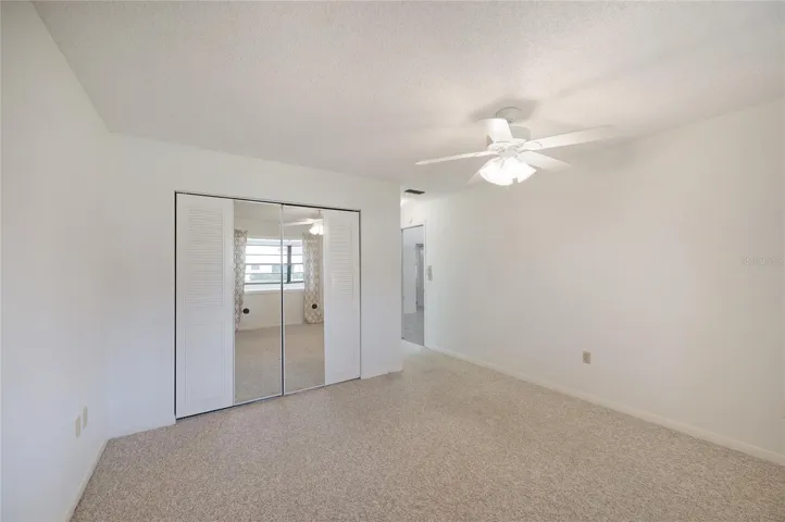 Primary bedroom with carpet