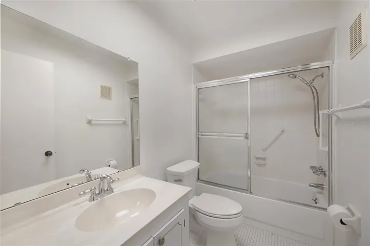 Guest bathroom with tub/shower ensuite to guest bedroom and accessible to the living area for guest use