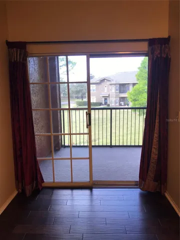 Primary Bedroom with View from Balcony