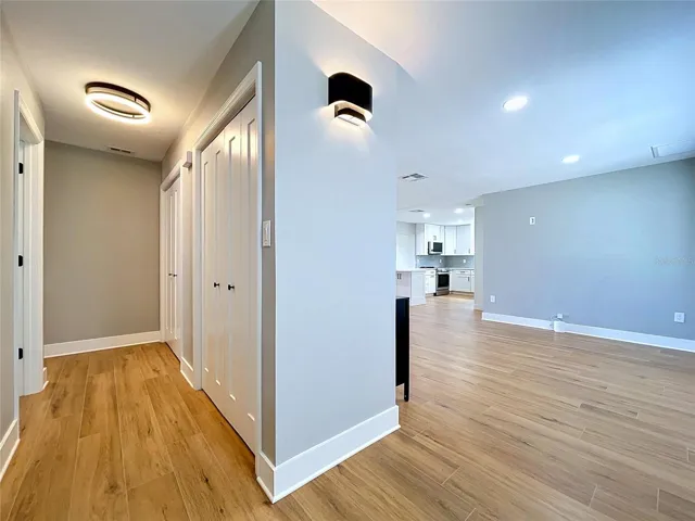 Hallway with storage closets