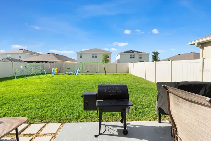 Fenced backyard with patio
