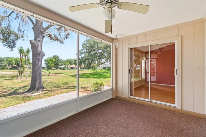 Lanai showing sliders into Primary Bedroom