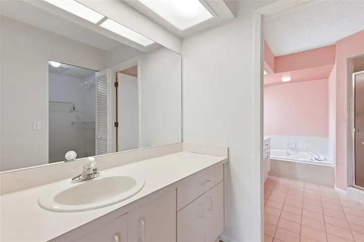 Separate vanity across from walk-in closet in Primary Bedroom