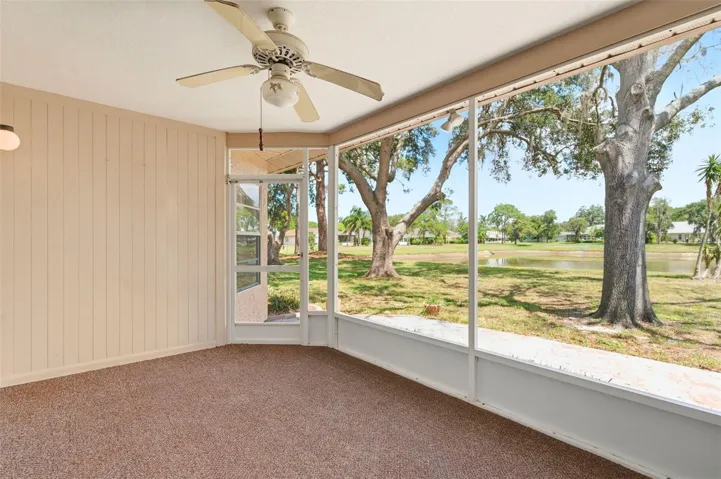 Screened lanai with view of pond