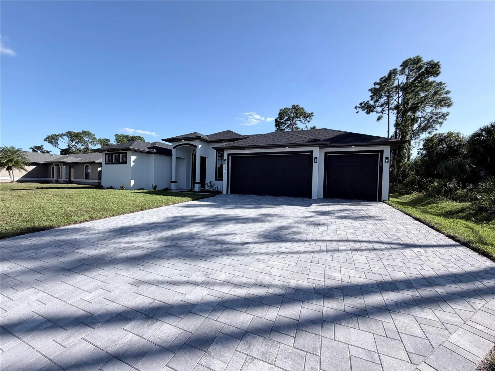 Front view 3 Car Garage Pavers Driveway