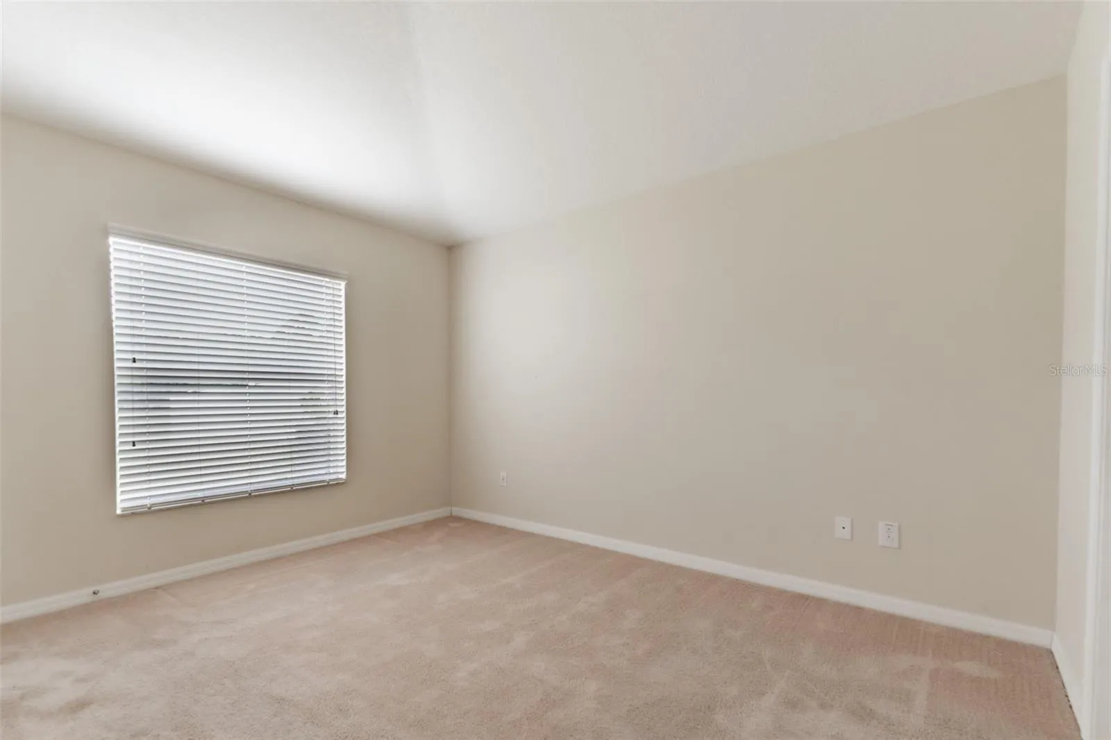 Primary Bedroom looking to backyard.