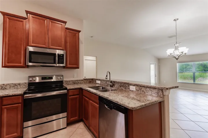 Kitchen looking to back of home.