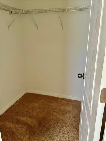 Primary bedroom walk in closet.