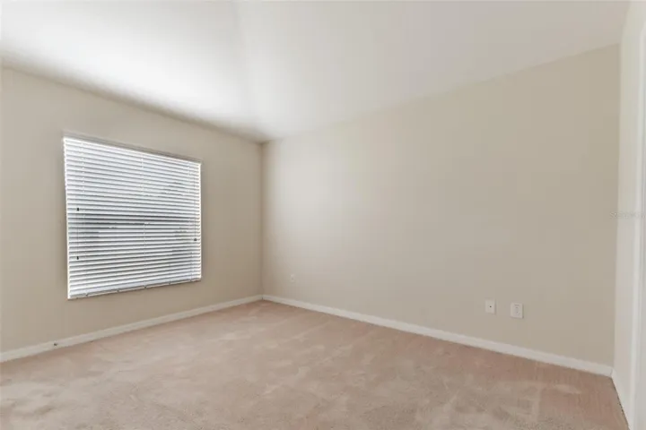Primary Bedroom looking to backyard.