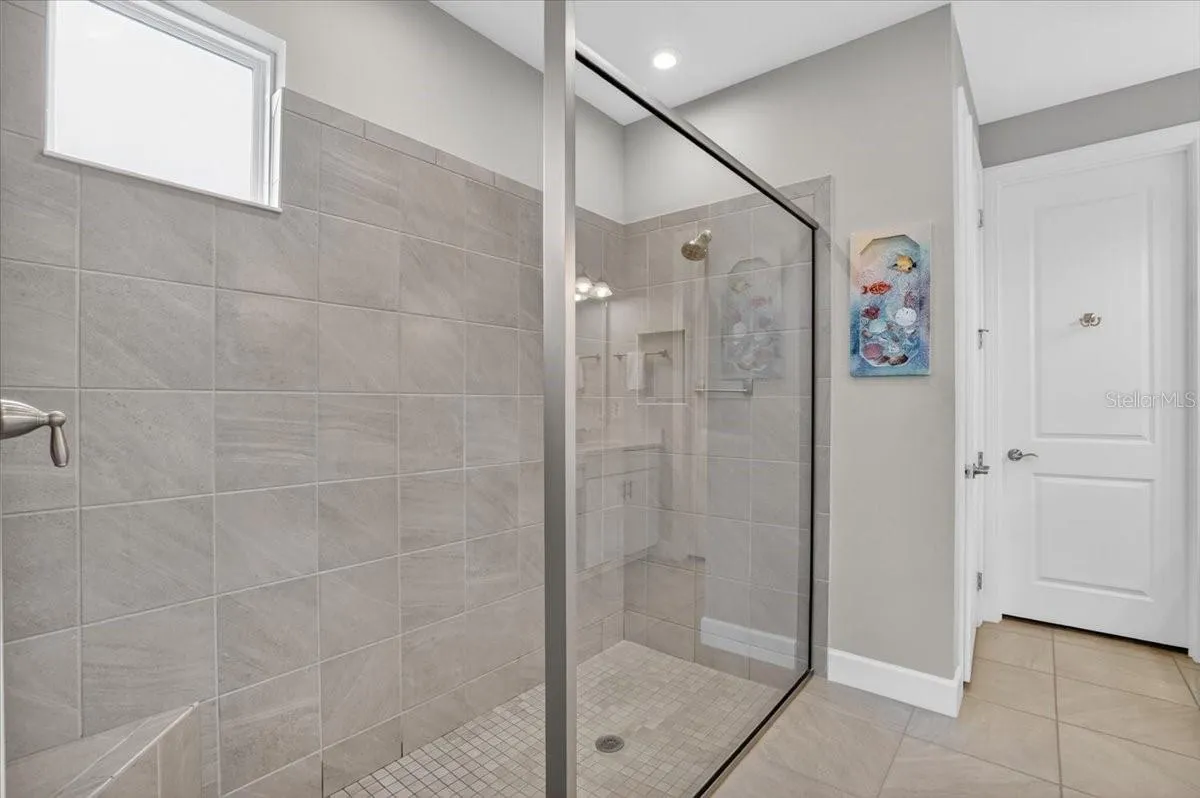 En-Suite Bathroom with walk-in shower and a large walk-in closet.
