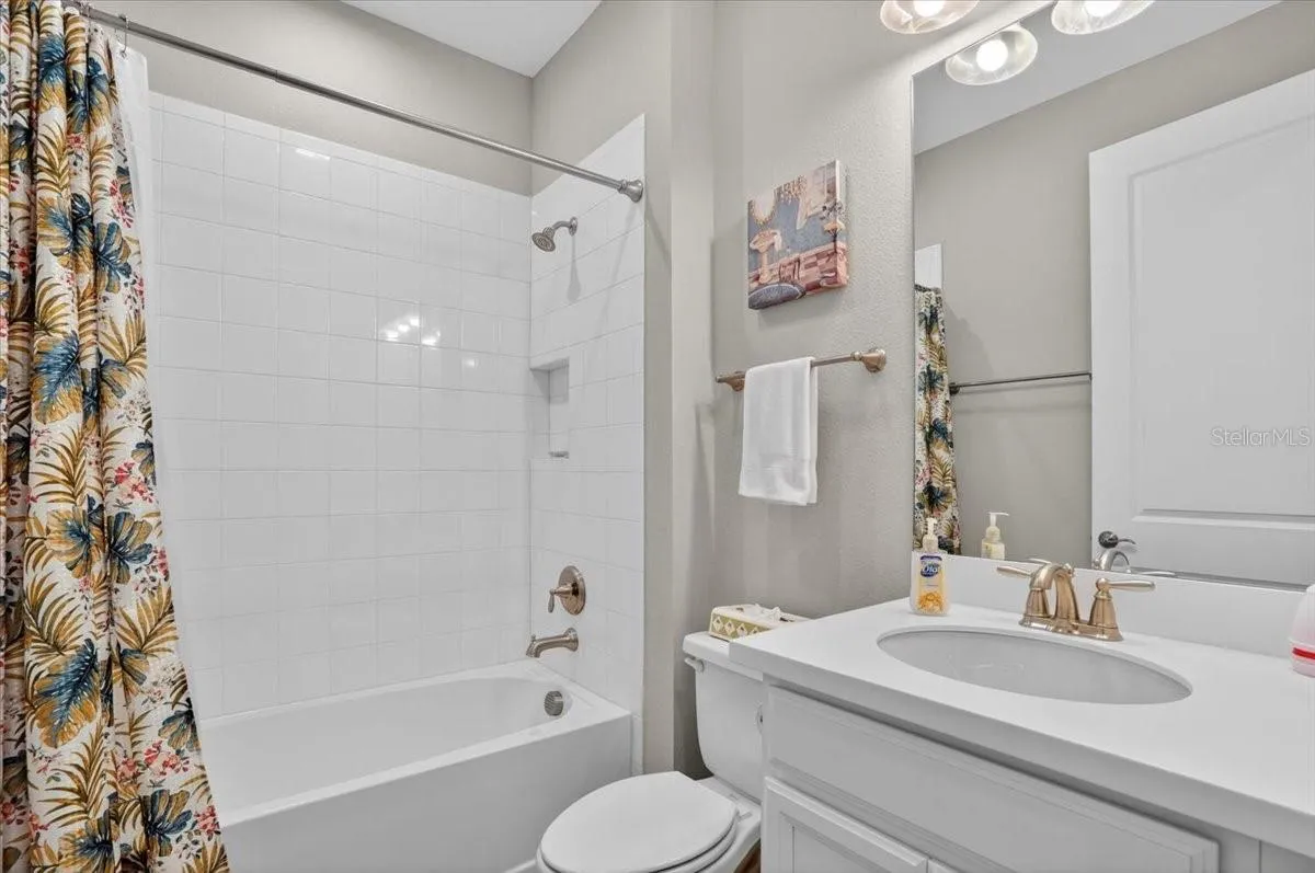 Full Bathroom with a tub/shower adjacent to Bedroom 2