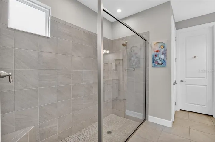 En-Suite Bathroom with walk-in shower and a large walk-in closet.