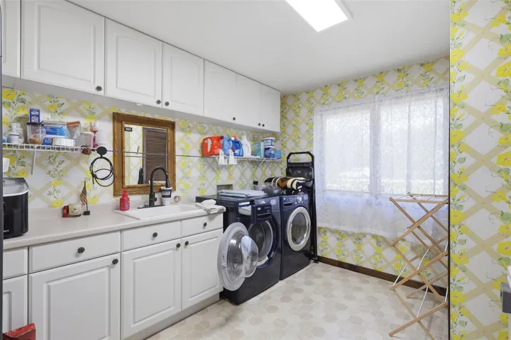 Laundry Room with Cabinets, Sink and Washer and Dryer