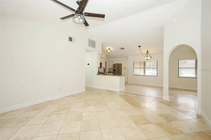 Family room with Travertine tile flooring.