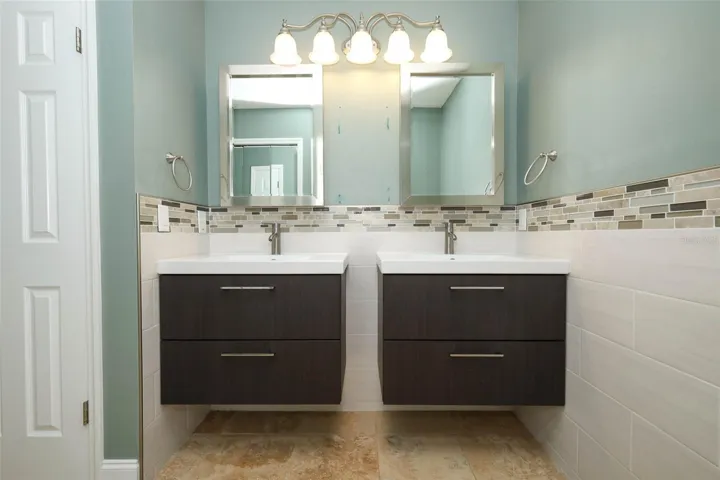 Primary bathroom with dual sinks.