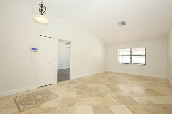 Formal living room with Travertine tile flooring.