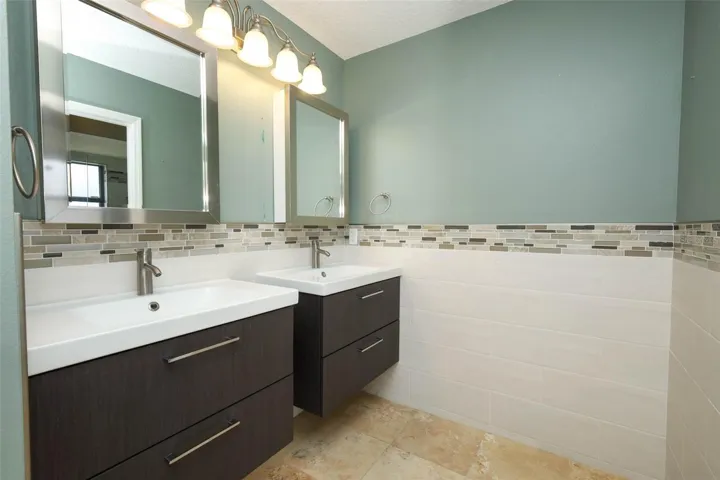 Primary bathroom with dual sinks.