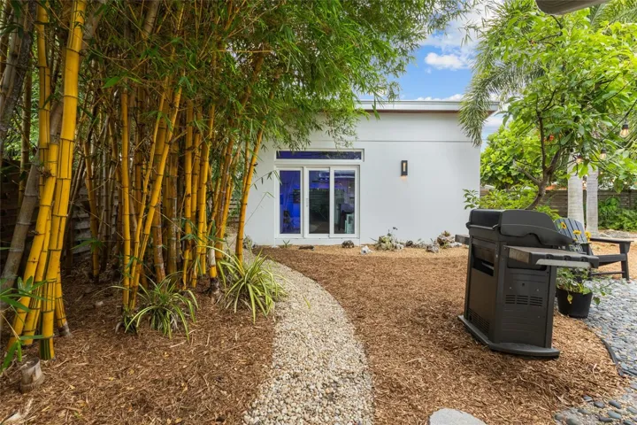 Backyard view leading to HURRICANE PROOF stand alone office/artist area