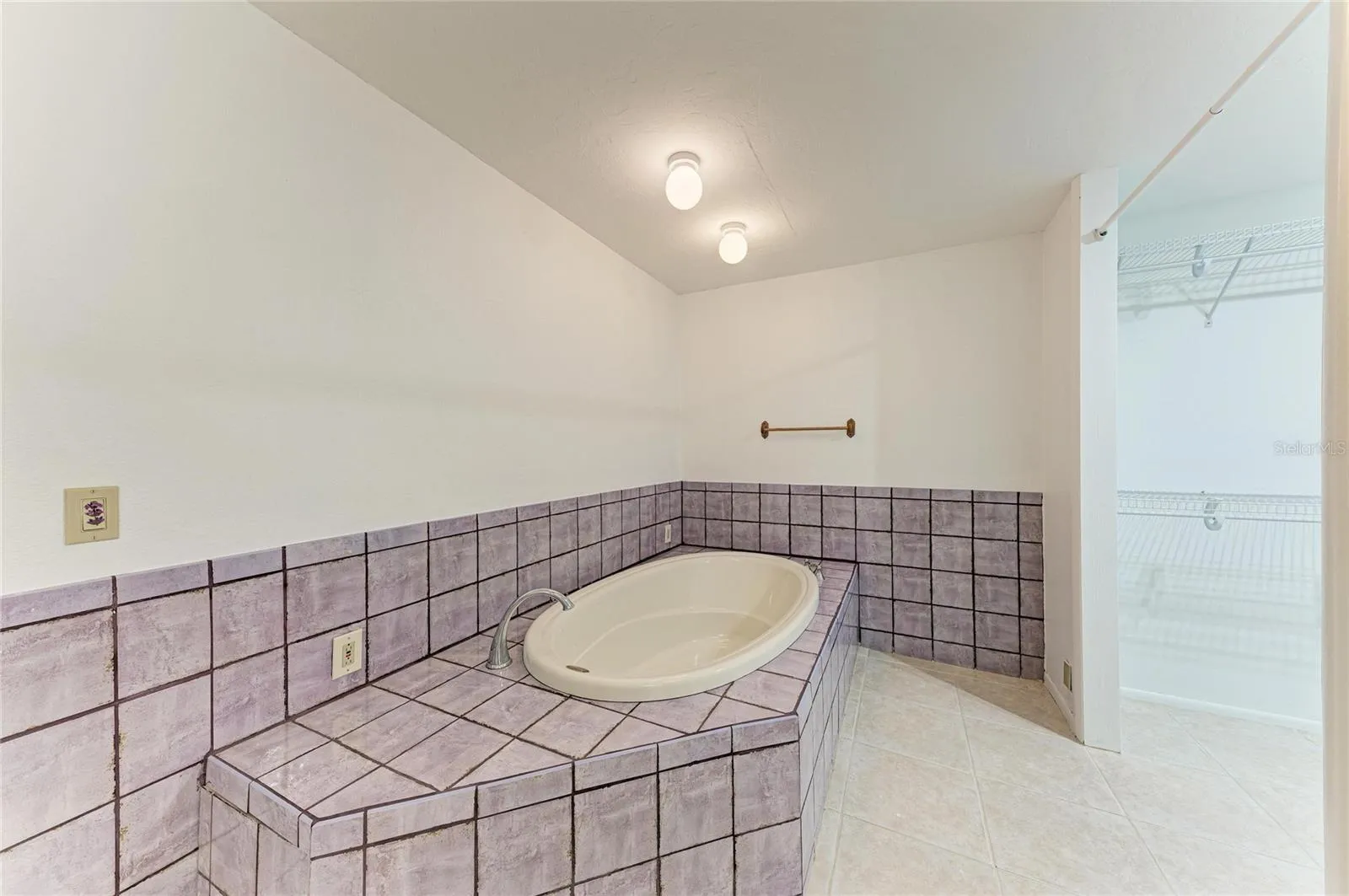 primary soaking tub with glamour closet