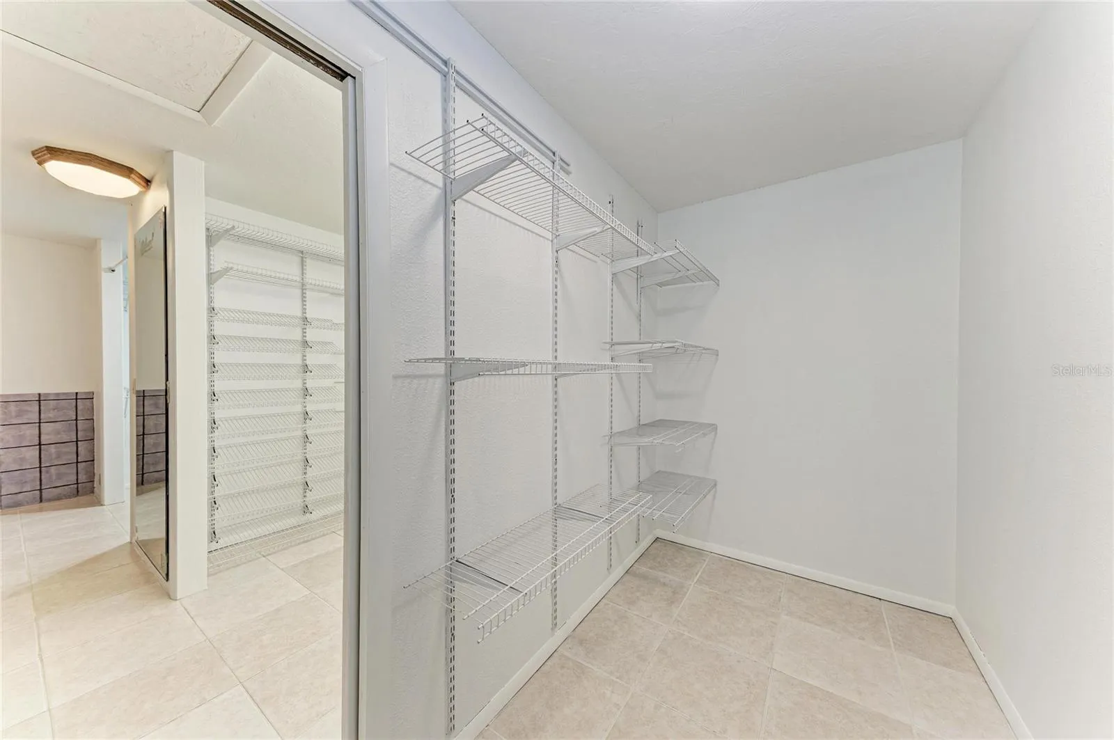 primary soaking tub with glamour closet