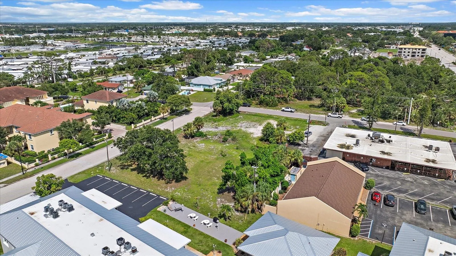 Aerial view of the lot overlooking the surrounding residential neighborhood