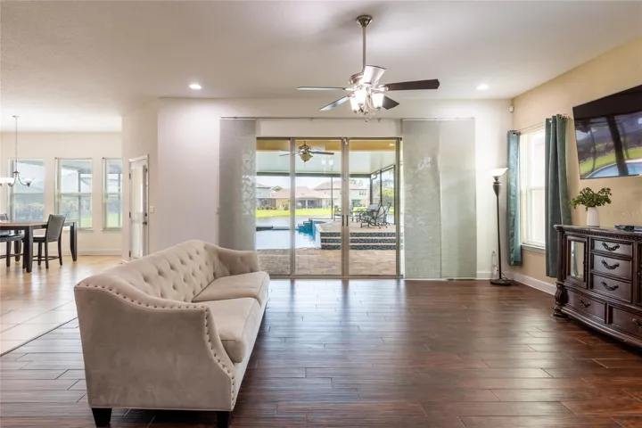 Great room overlooks the pool and pond.